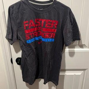 Men’s Nike “ Faster & Stronger than last year” shirt.